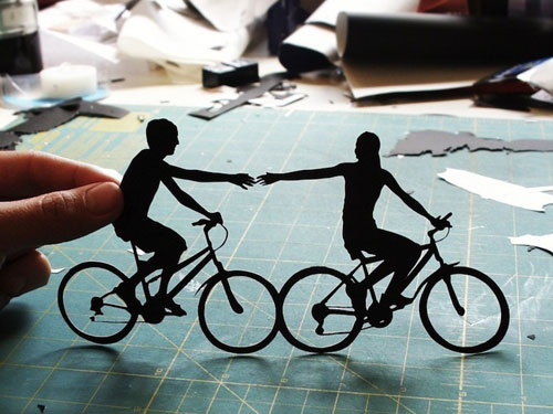 Papercut Silhouette Of Couple On Bicycles