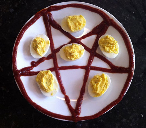 Deviled Eggs On A Plate With A Ketchup Pentagram