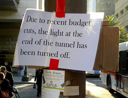 Sign at Occupy Portland - Due To Recent Budget Cuts, The Light At The End Of The Tunnel Has Been Turn Off