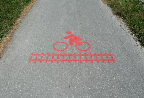 Train Track Crossing Sign On A Bike Path
