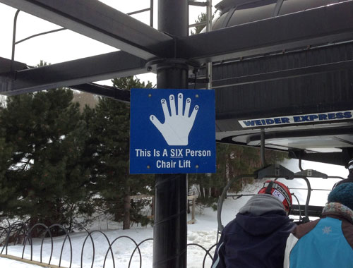 Sign For A Six Person Chair Lift Using Six Fingers