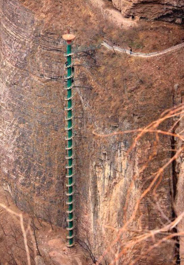 Extremely Tall Spiral Staircase On The Side Of A Cliff In China